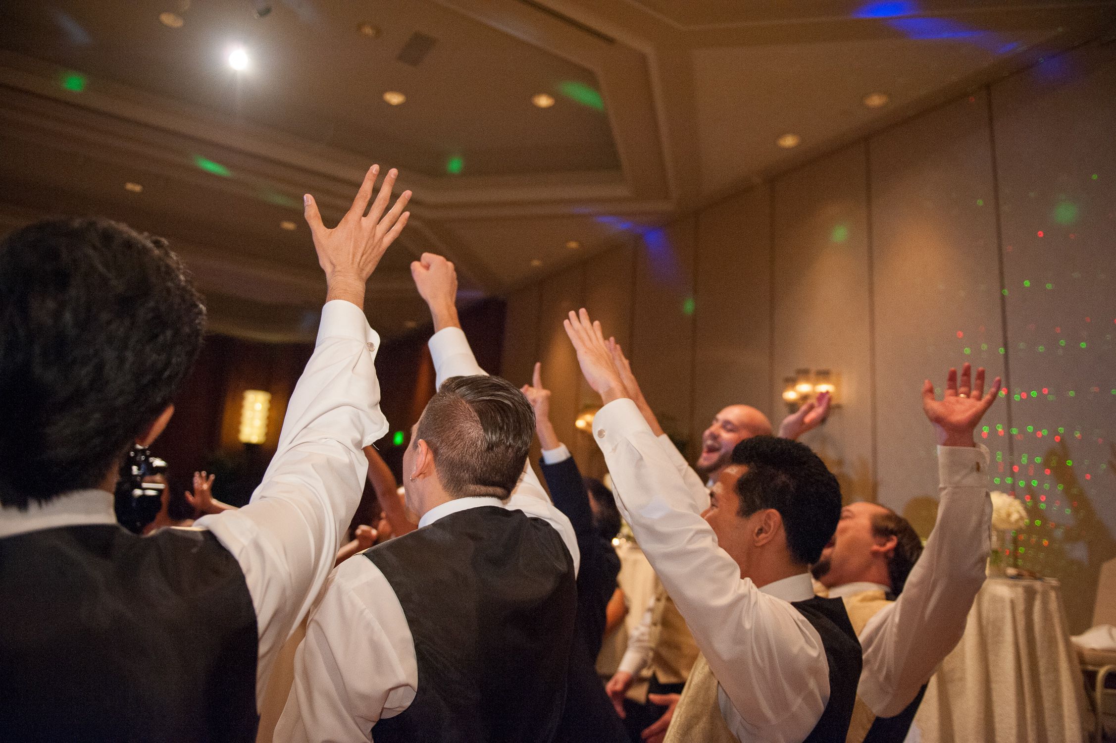 Groomsmen cheering at end of reception