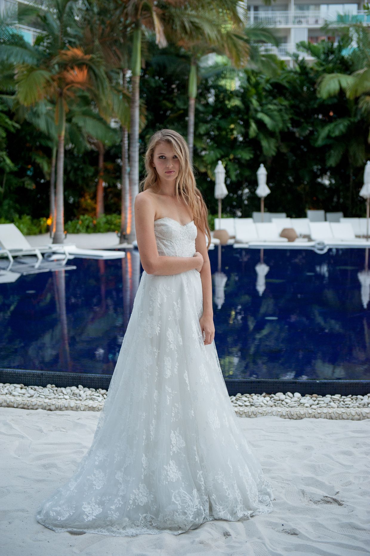 Bride standing in front of pool at the Modern hotel