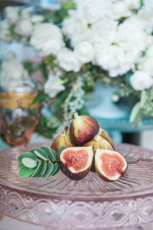 Close up of figs on a pink cake platter