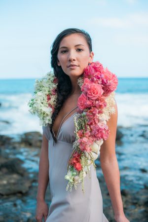 Bride with pink floral draping lei