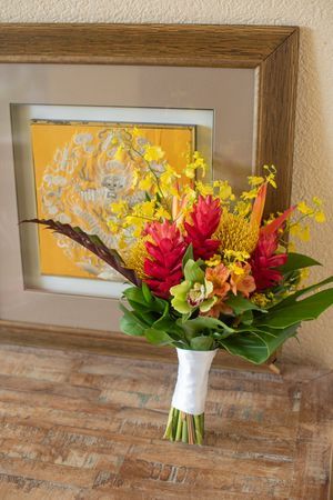 Tropical bouquet in front of yellow artwork