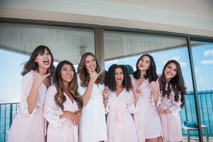 Bridal party laughing for the camera