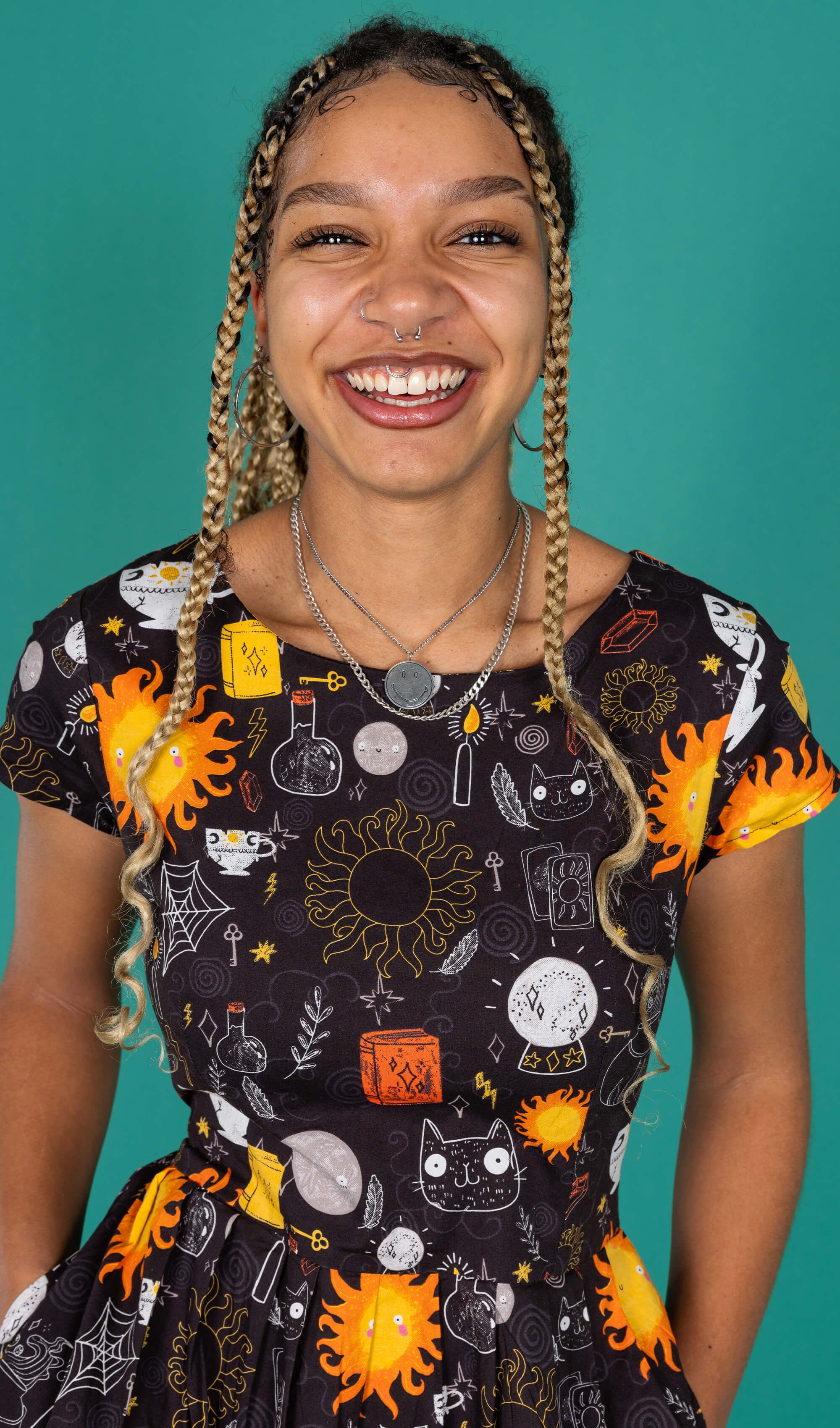 Milly a black thin model with braids wearing a black tea dress  by Run & Fly
