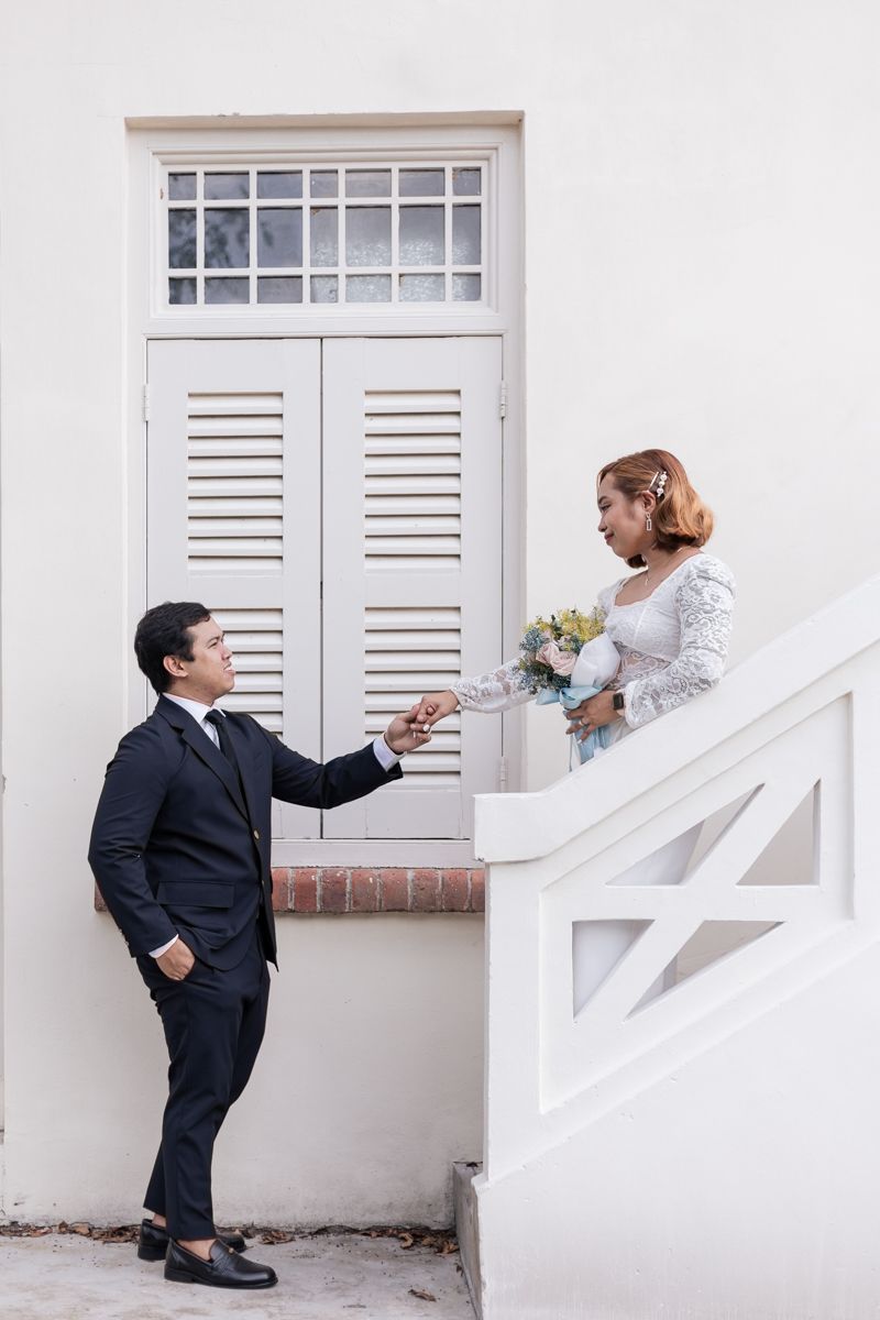 Wedding couple posing at Fort Canning after their ROM solemnisation at the Registry of Singapore.