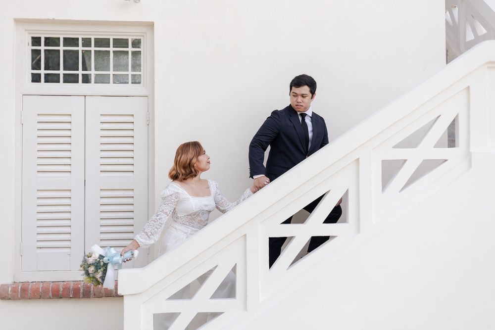 Wedding couple posing at Fort Canning after their ROM solemnisation at the Registry of Singapore.