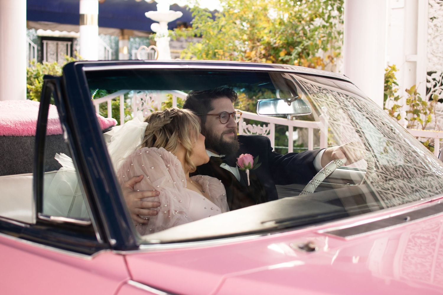 Cuddled up in the pink Cadillac at the Little White Chapel in Las Vegas