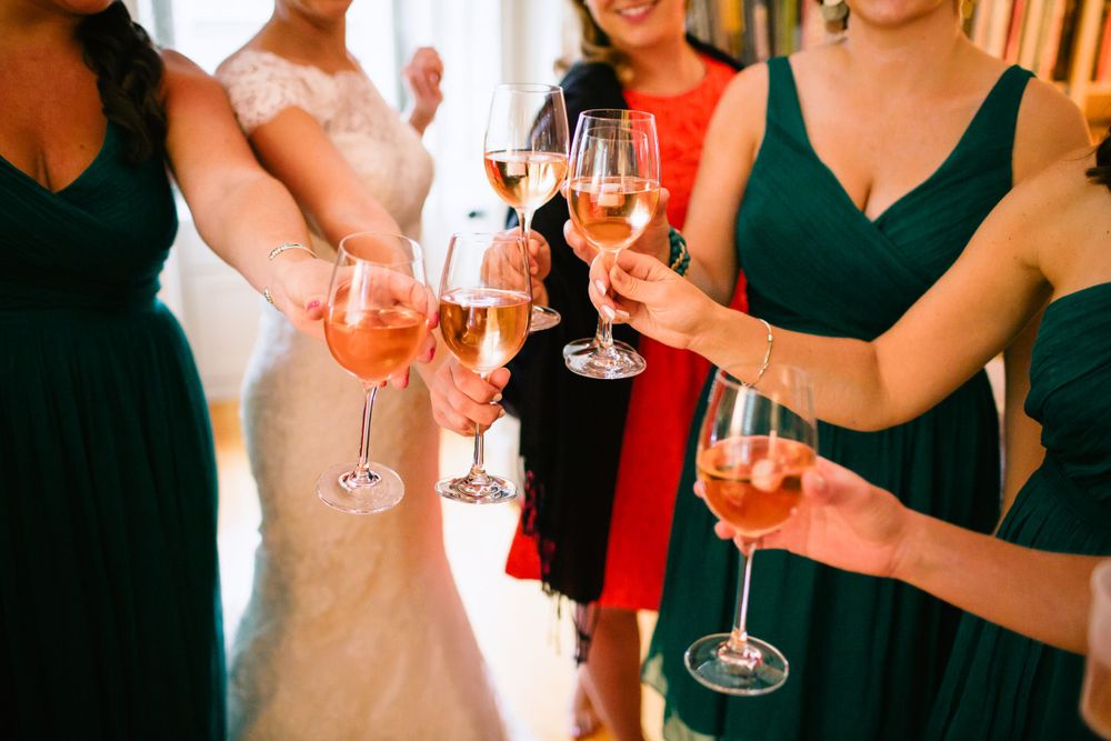 Bridesmaids share a celebratory toast at a Harvard, MA wedding