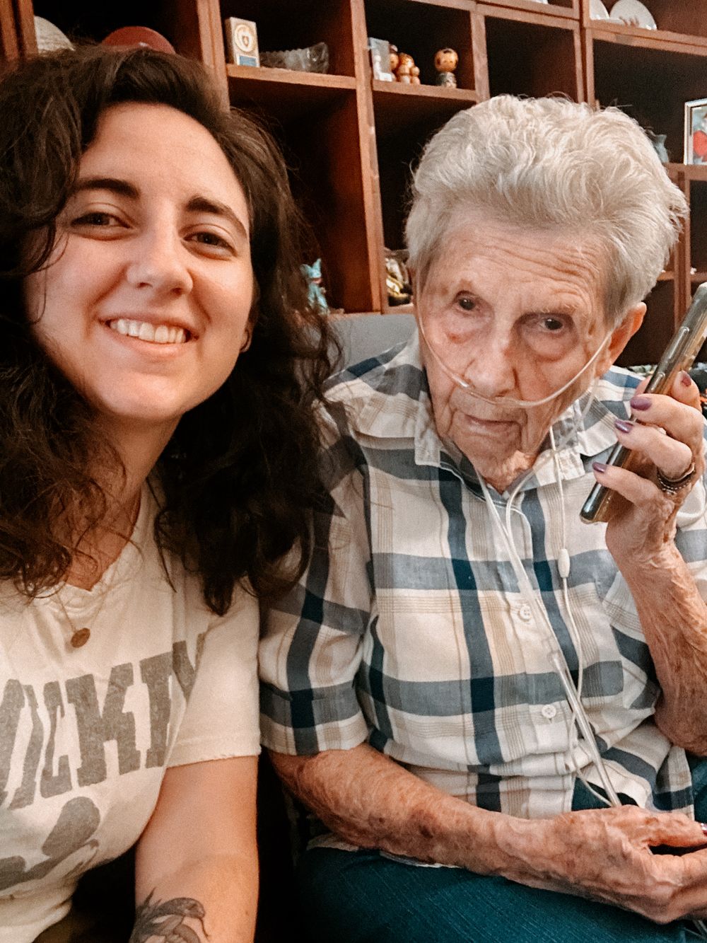 A series of selfies showing warm moments shared between a young woman and elderly person in a plaid shirt.