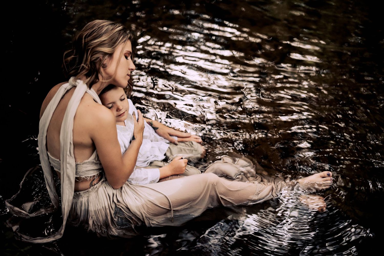 lakeland family photographer- mom and son in the creek