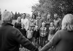 Black and white candid shots of family members laughing together outdoors.