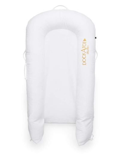 White baby co-sleeper bassinet with soft padded sides for safe sleeping.