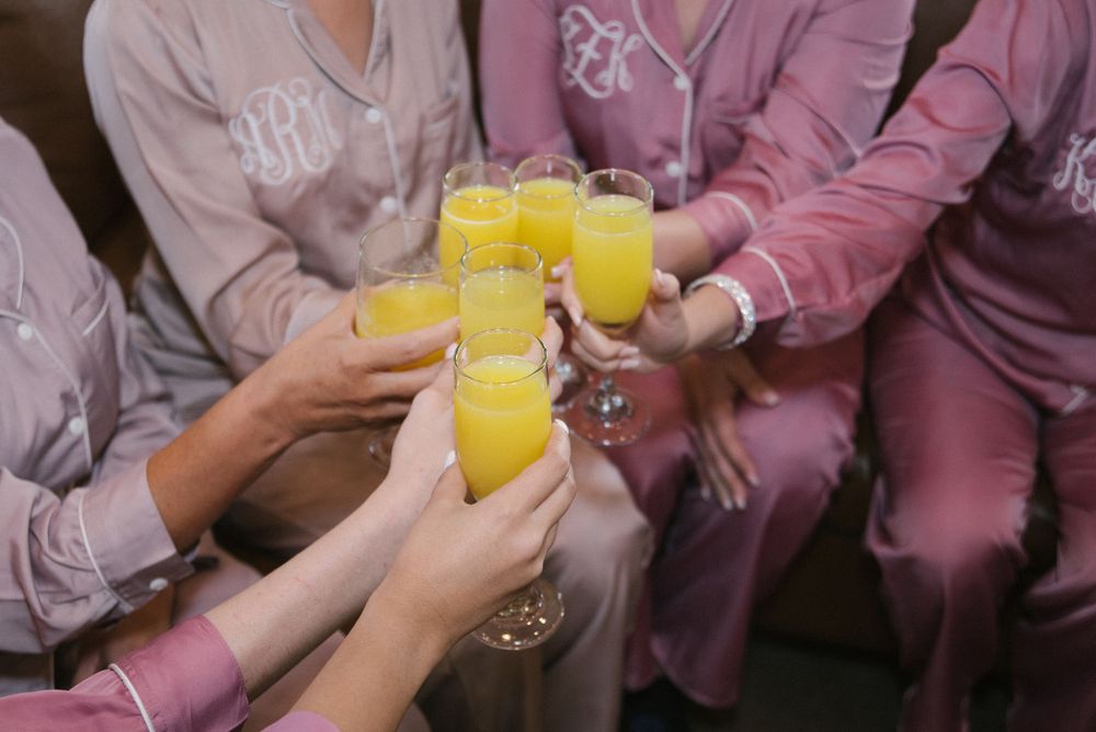 bride's getting ready. mimosa toast. pink robes. bride's accesories. getting ready. Rancho Guadalupe. Edinburg, Texas