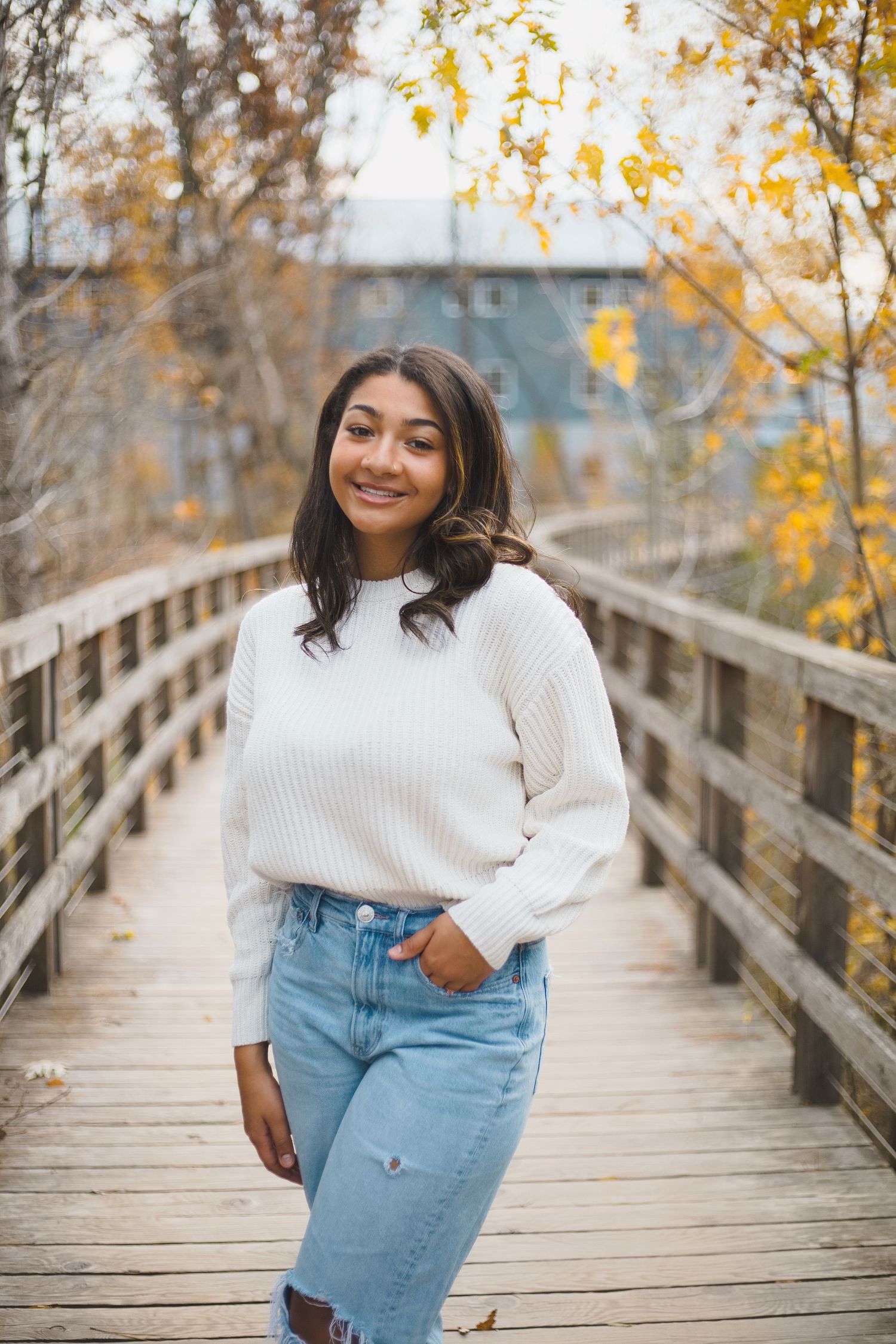 Senior photo female girl fall colors verona wi epic bridge