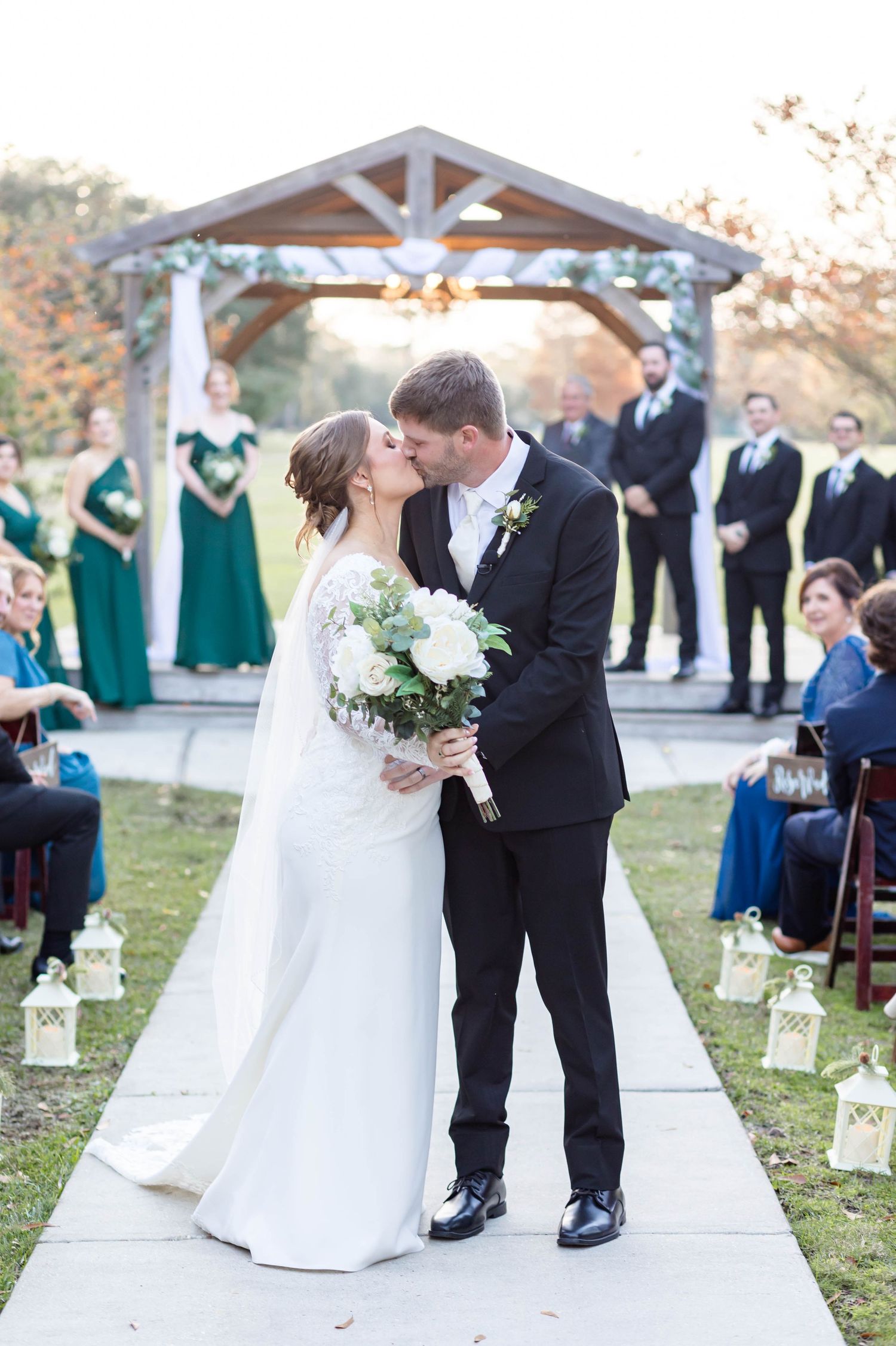 bride and groom kiss back down the aisle