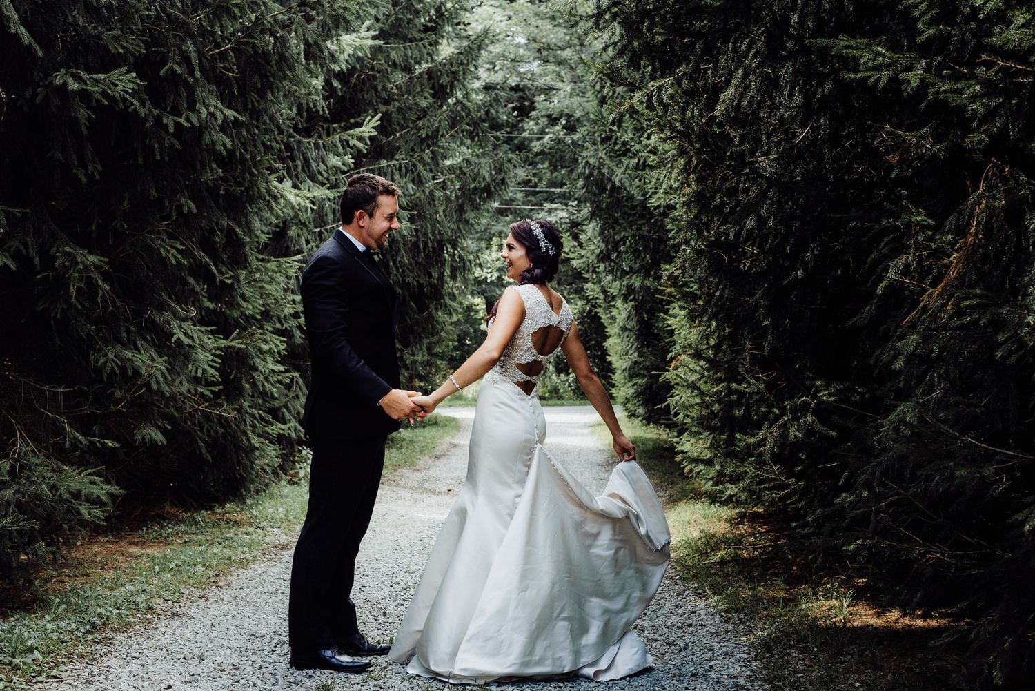 Bride and groom dance and twirl for wedding photos