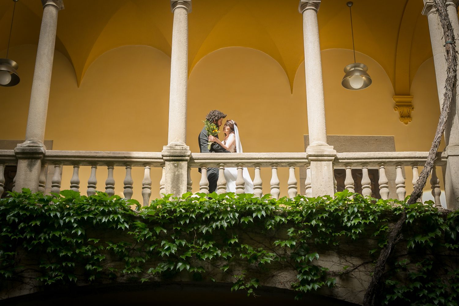 Bride and groom on the balcony after getting married