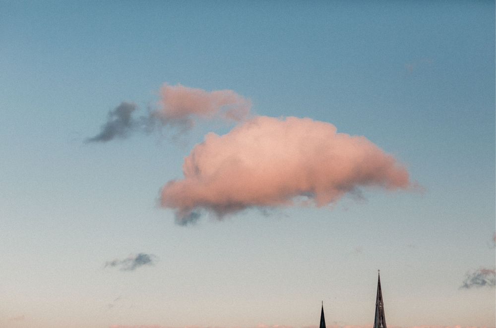 blue sky with pink clouds as sun setting