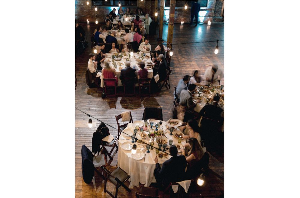 wedding guests eat dinner at reception