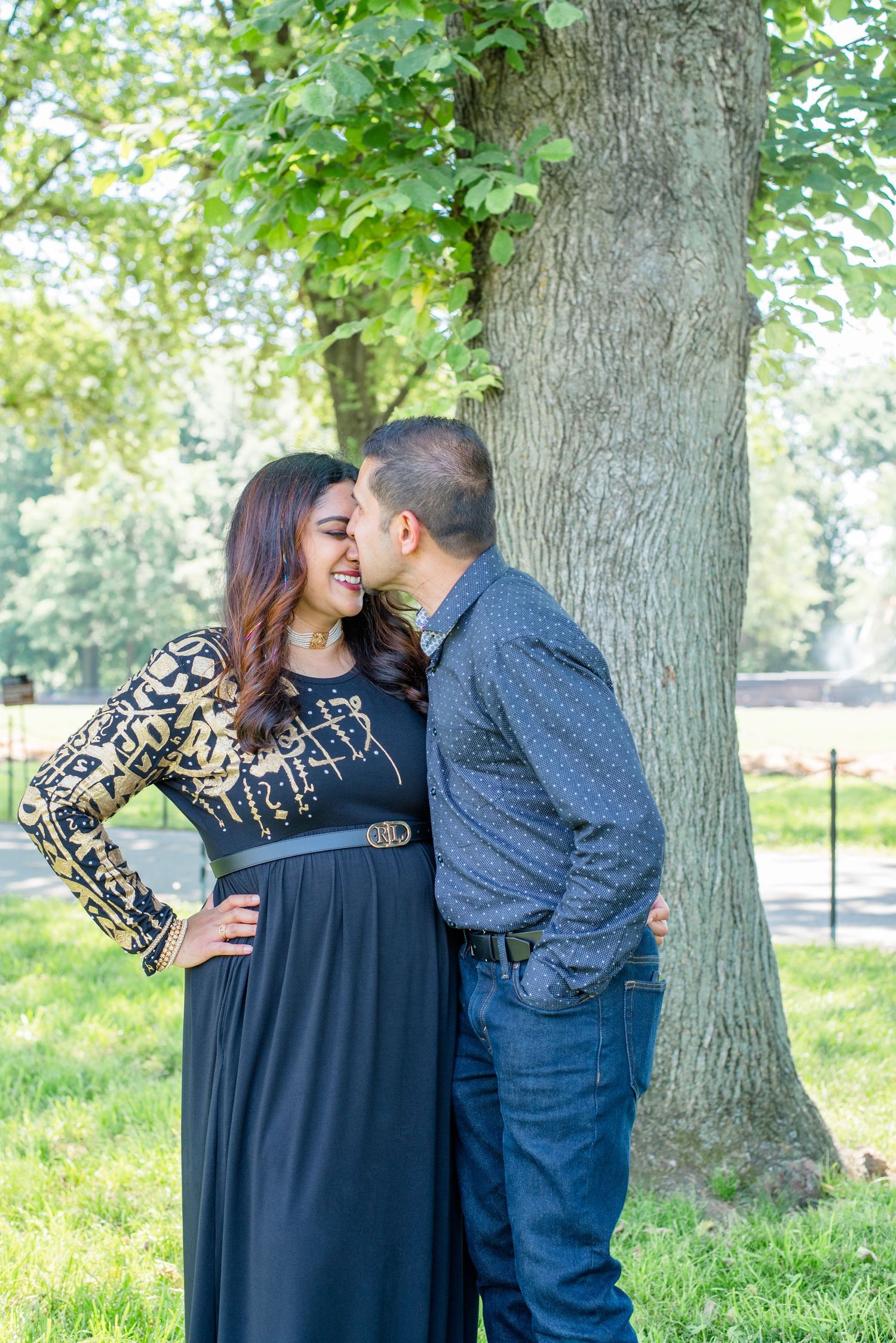 husband kisses wife on nose as she laughs