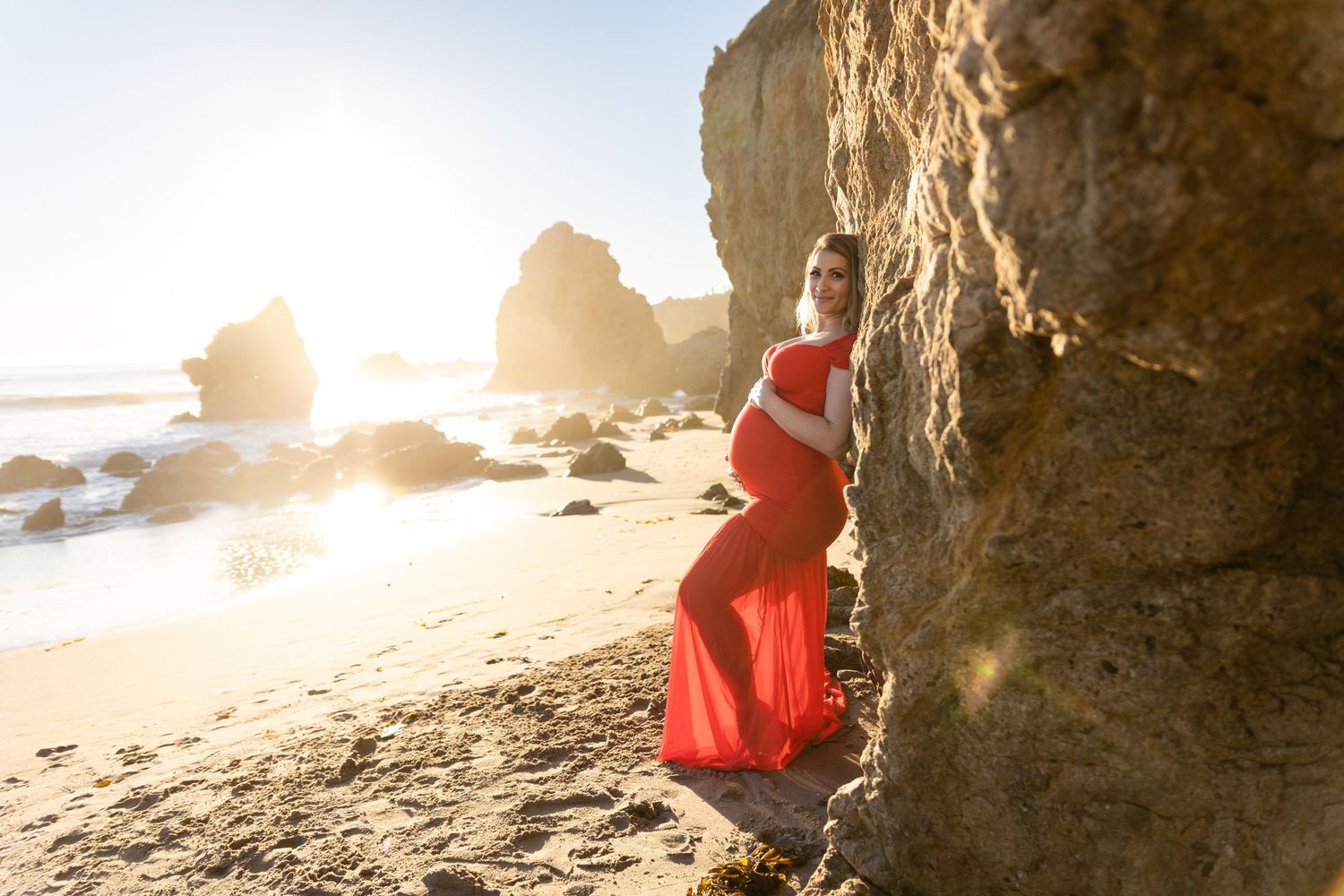 Maternity photo of expecting mother on a beach in Malibu