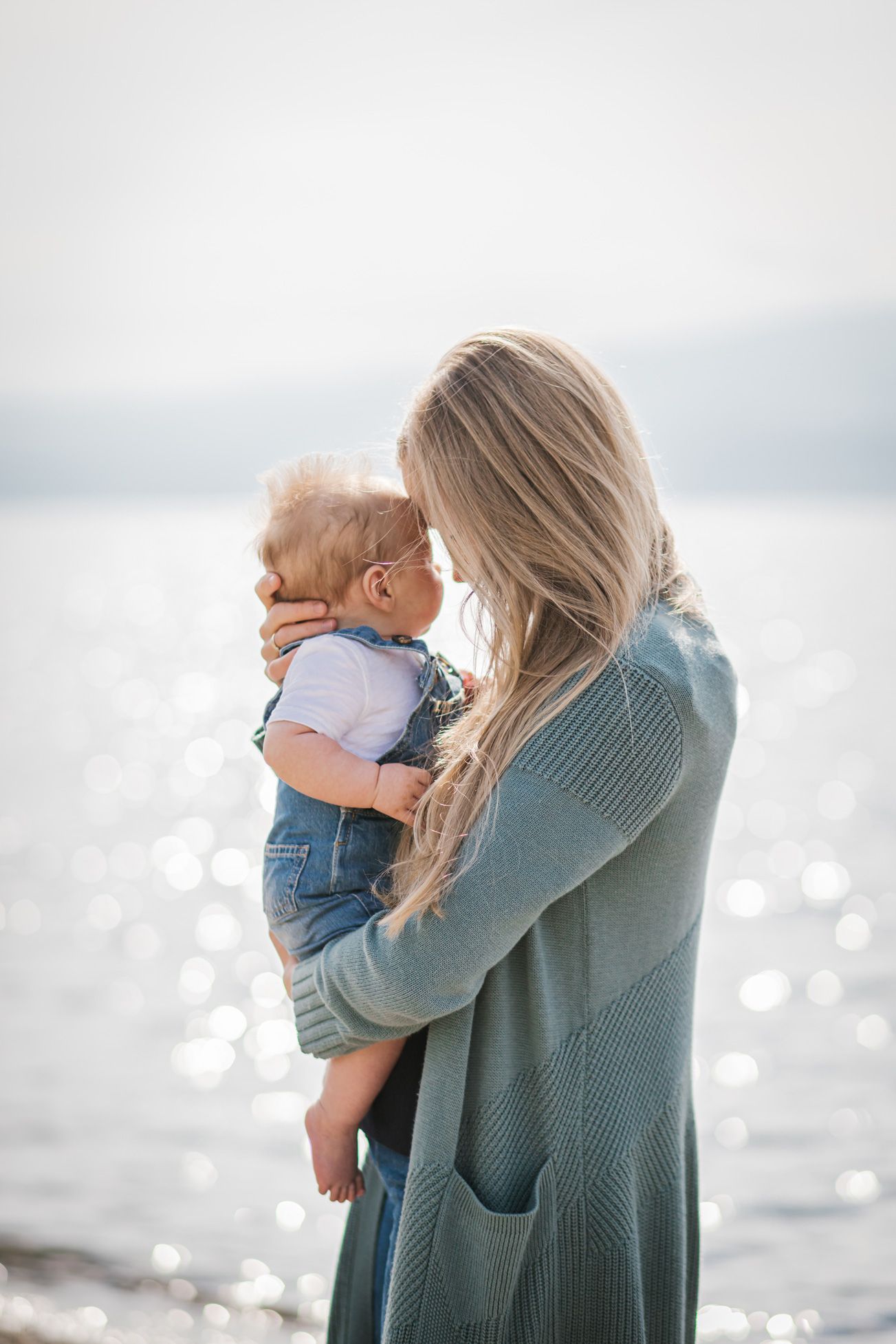 Intimate portrait session by sparkling water with soft natural lighting.
