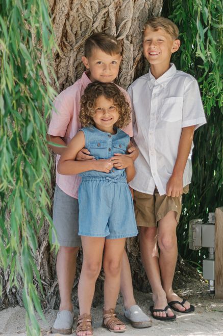 Close-up portrait series under willow tree branches showing casual summer outfits.