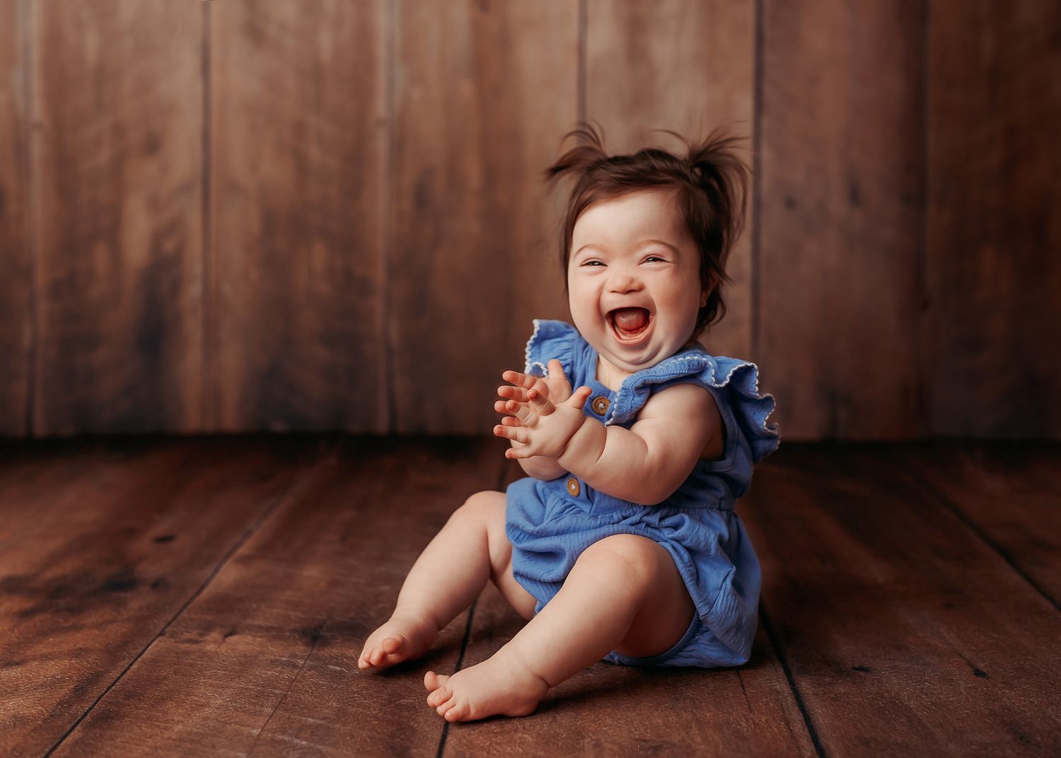 baby girl in blue at her photography session
