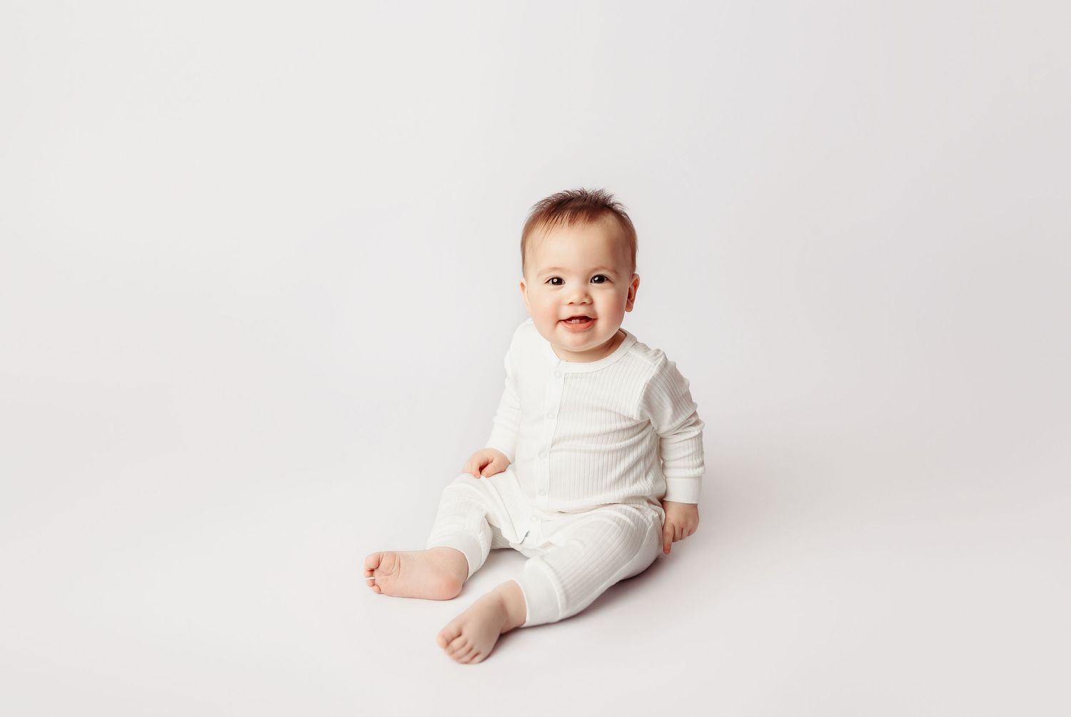 baby boy smiling at his milestone session in tulsa,ok