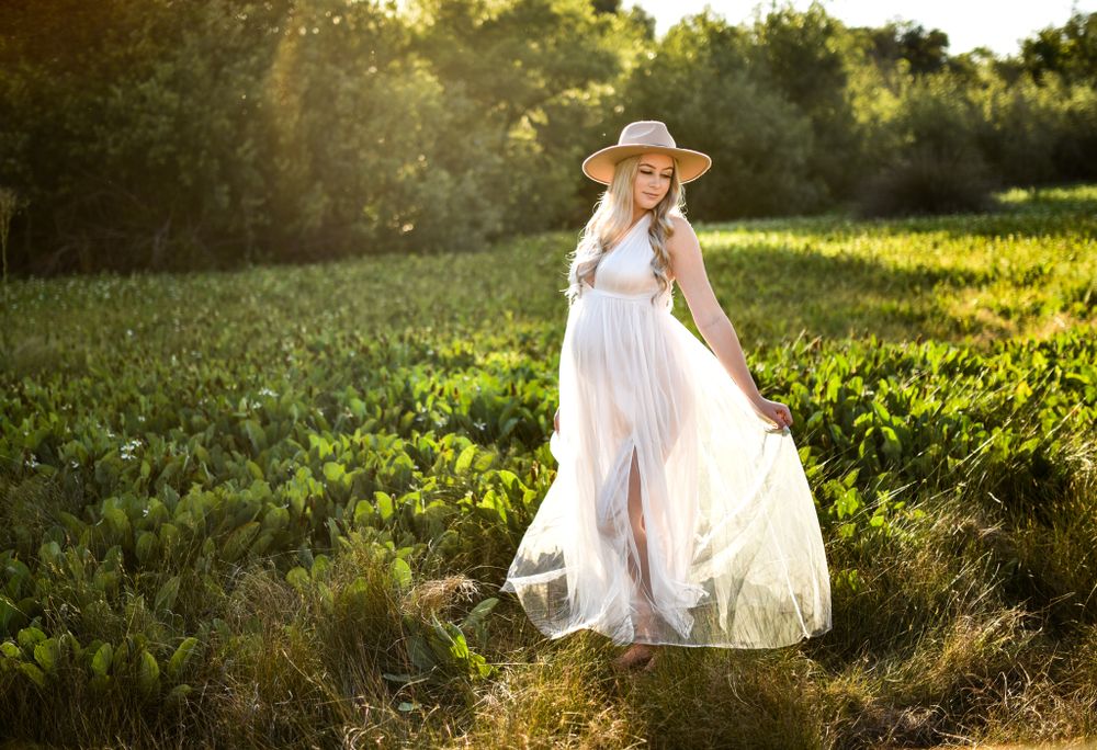 Beautiful glowing momma in a white boho dress in Fallbrook