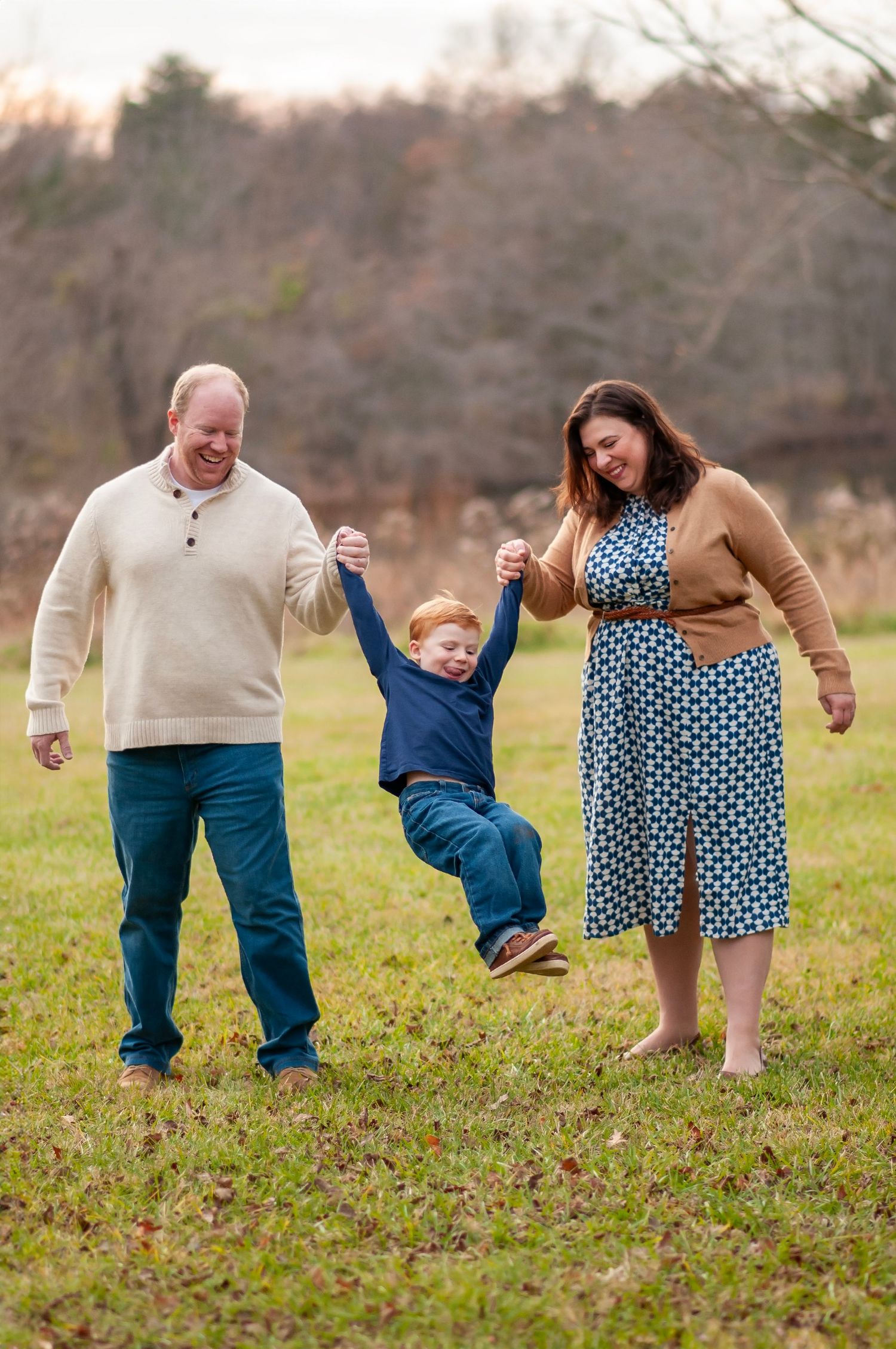 Family swinging toddler photo