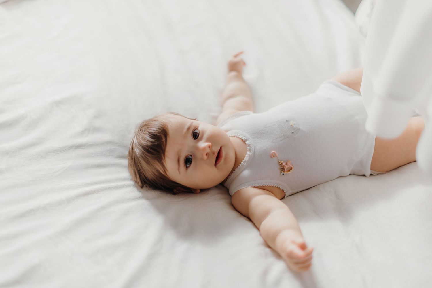 baby girl christening photos white bed