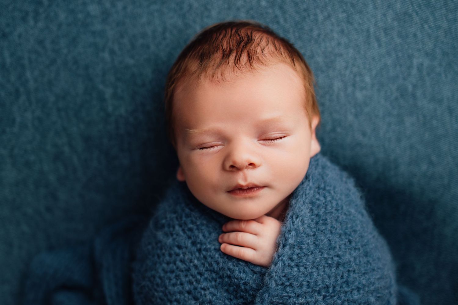 wrapped baby newborn photographer