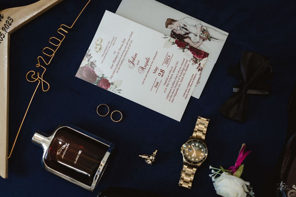 Wedding stationery and invitation suite displayed on dark navy background.