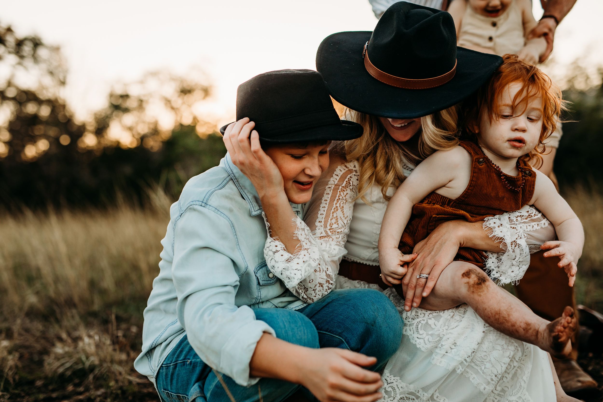 Family photographer, a mother hugs her teenage son, San Marcos family photographer