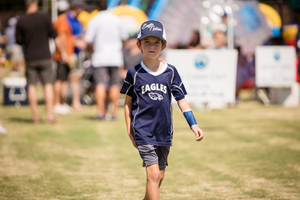 Children playing outdoor games and sports at a community event.