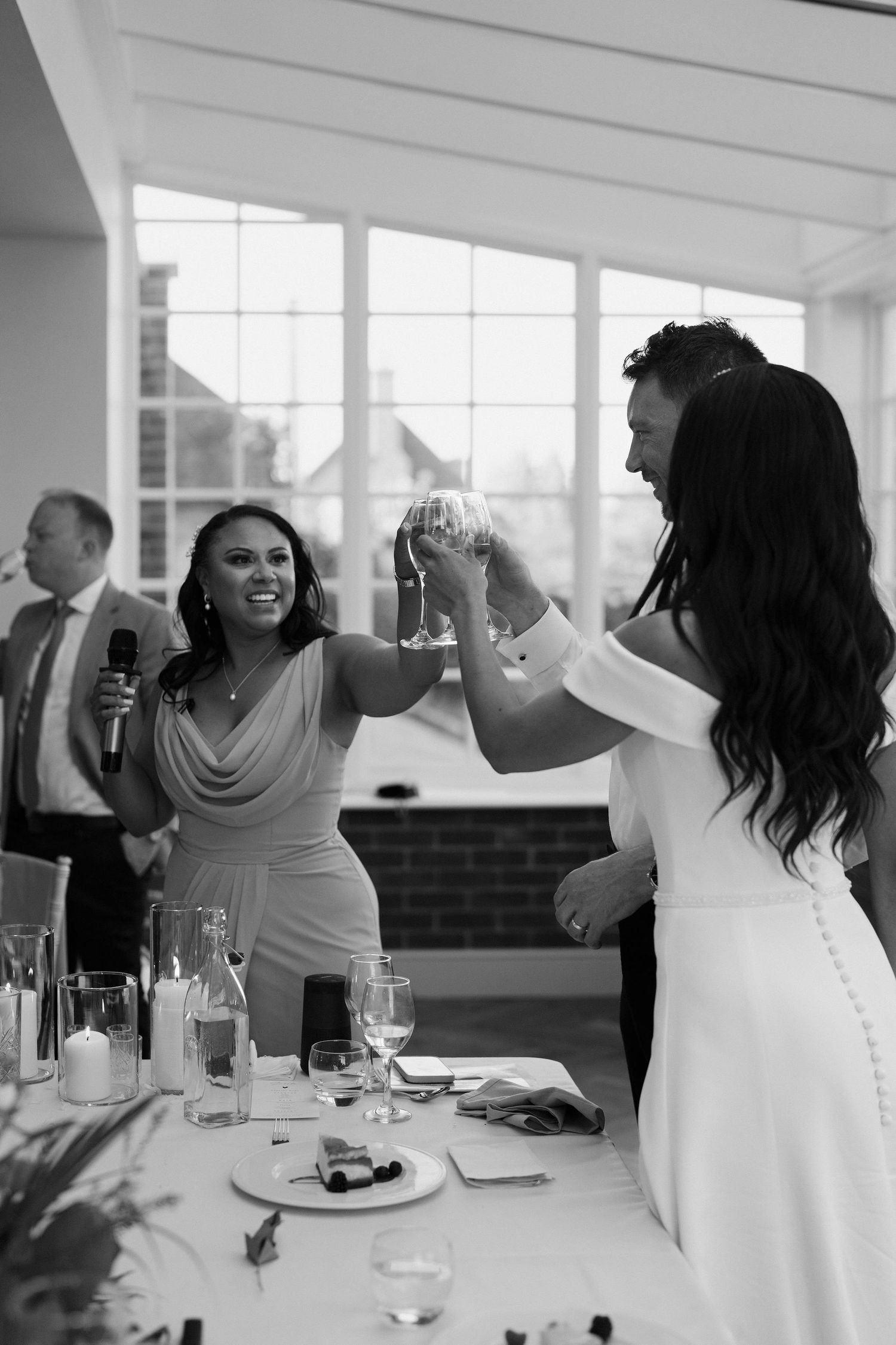 bridesmaid-toasting-bride-and-groom-stockton-house-wedding-shropshire