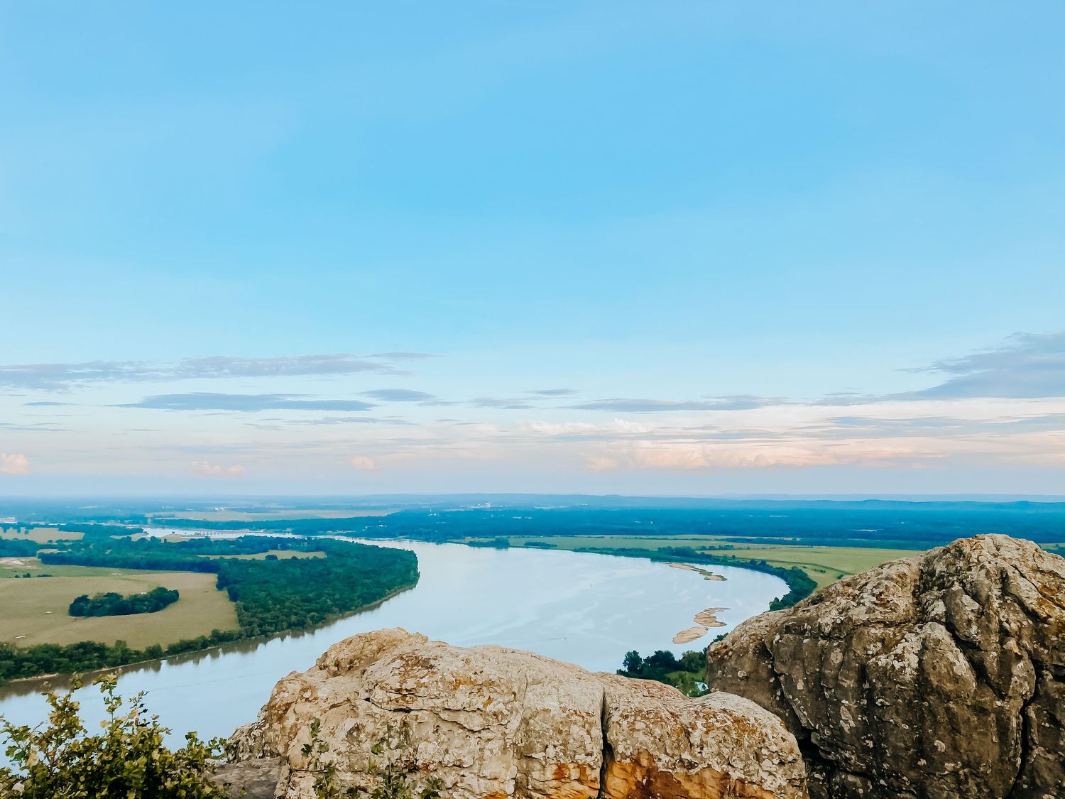 Panoramic mountain vista overlooking ocean and islands on a clear day.