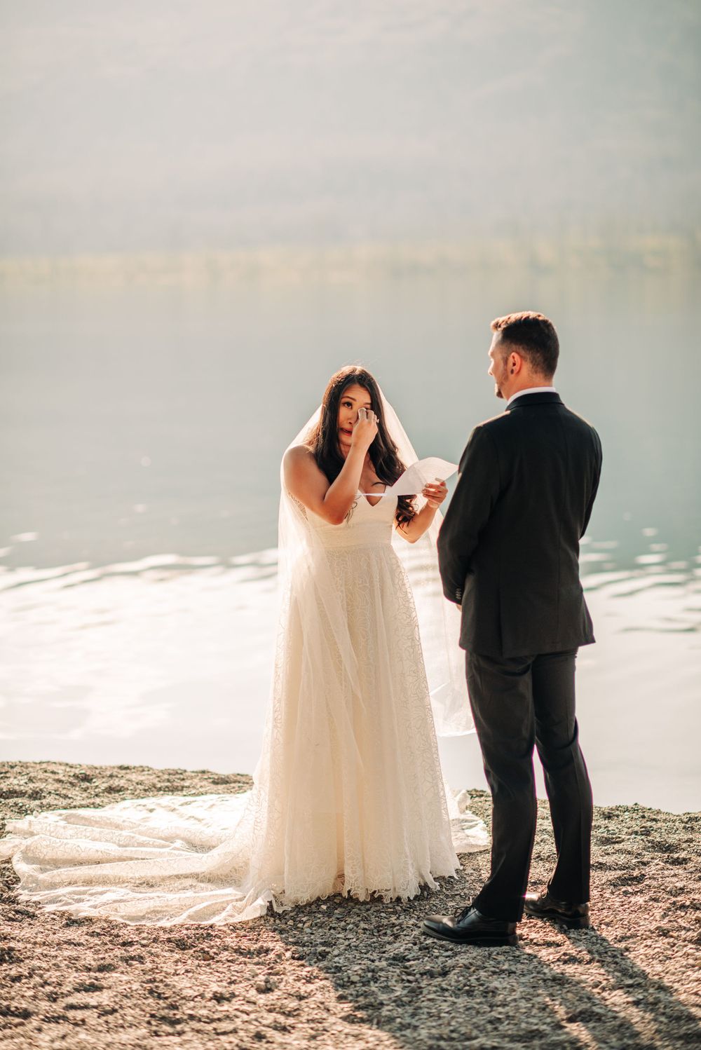 bride crying during vows at an elopement in Glacier National Park
