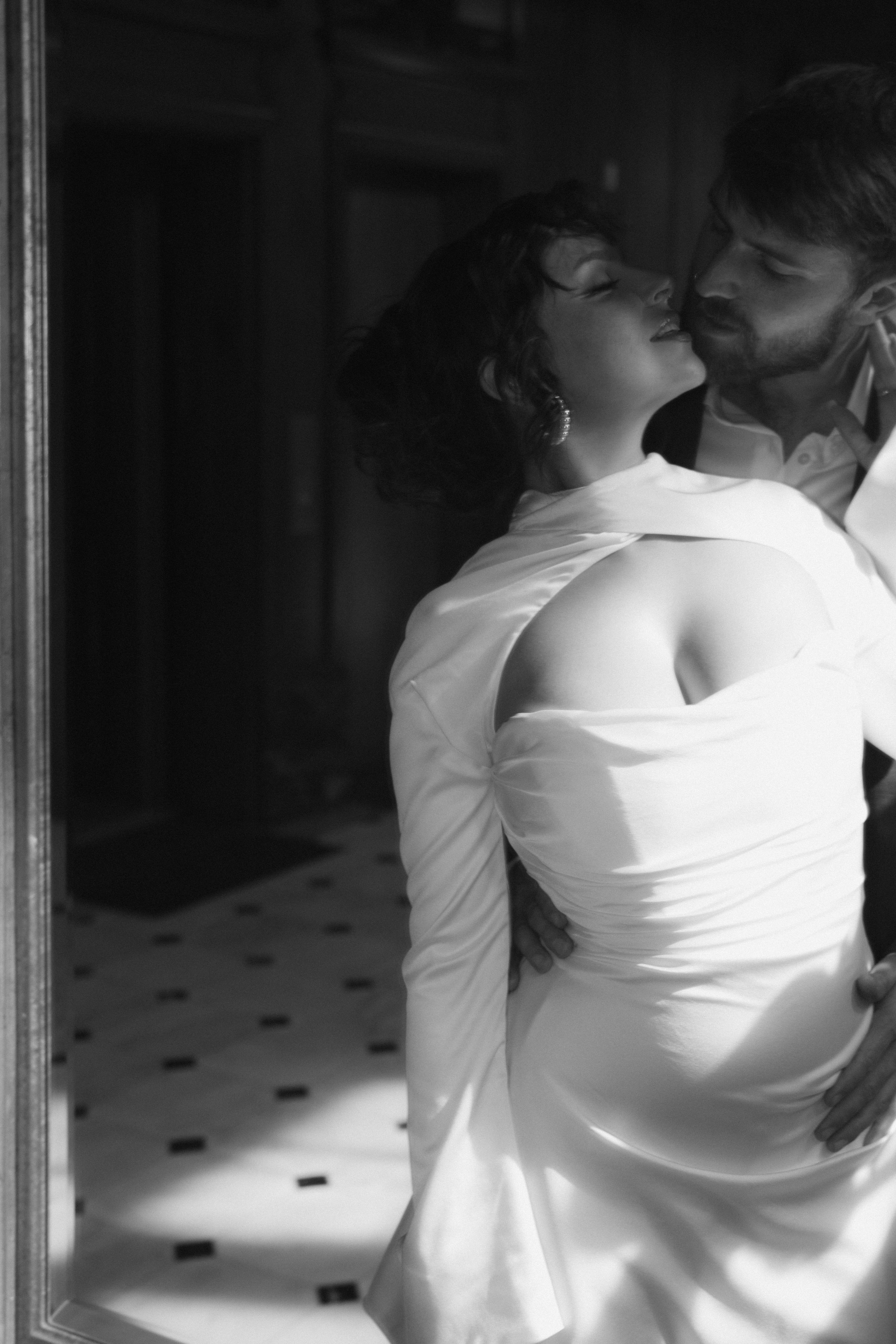 Artistic black and white photo sequence showing intimate dance movements in formal attire.
