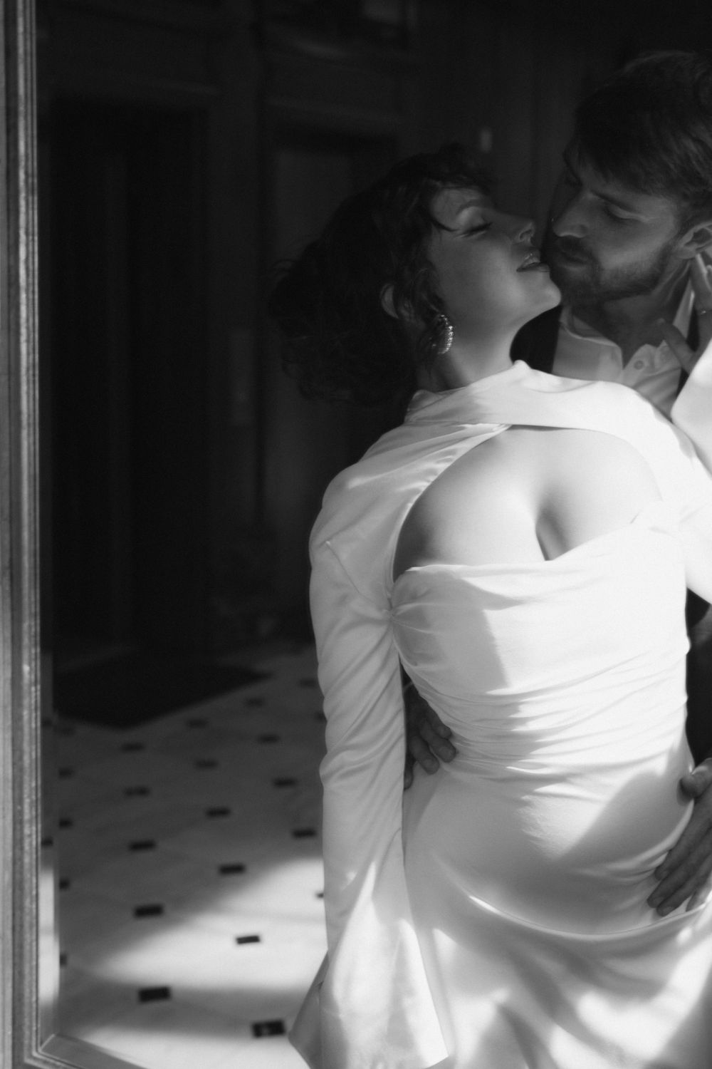 Artistic black and white photo sequence showing intimate dance movements in formal attire.