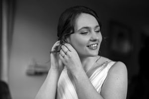 Black and white candid shots capturing joyful bridal moments.