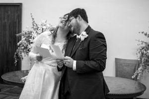 Black and white wedding photo series capturing intimate moments of a couple's special day.