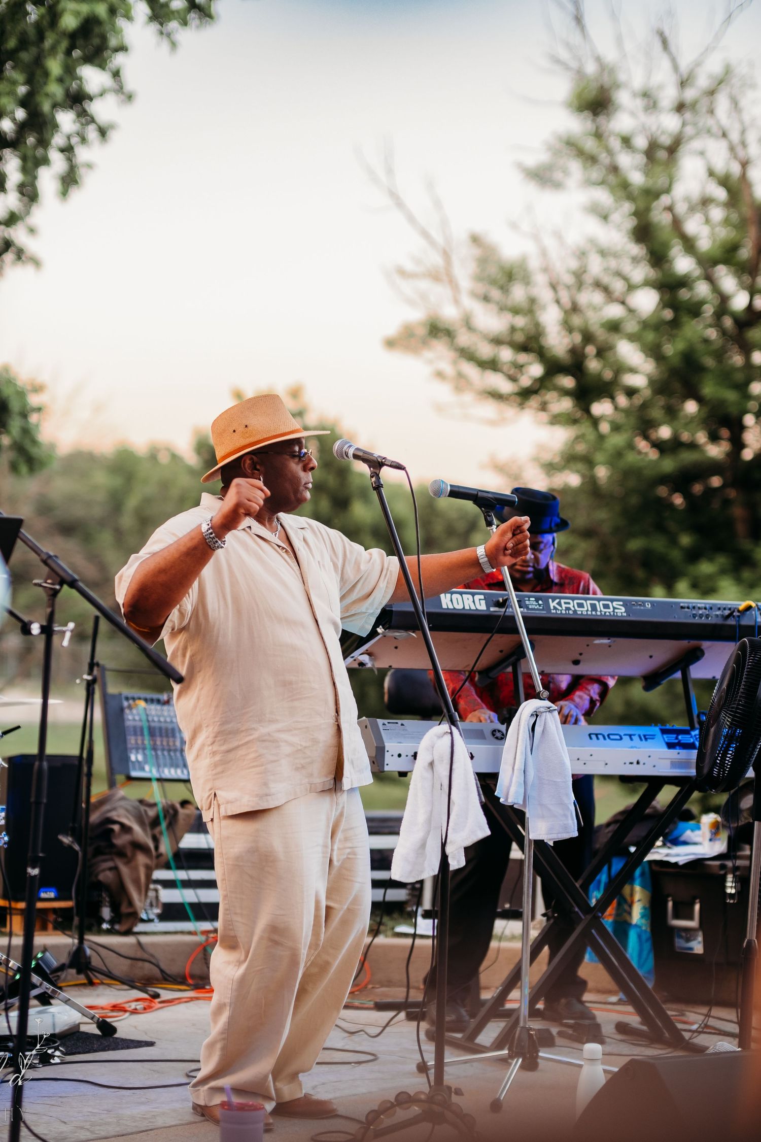 Man dances on stage by a microphone during event in St. Joseph, Missouri.
