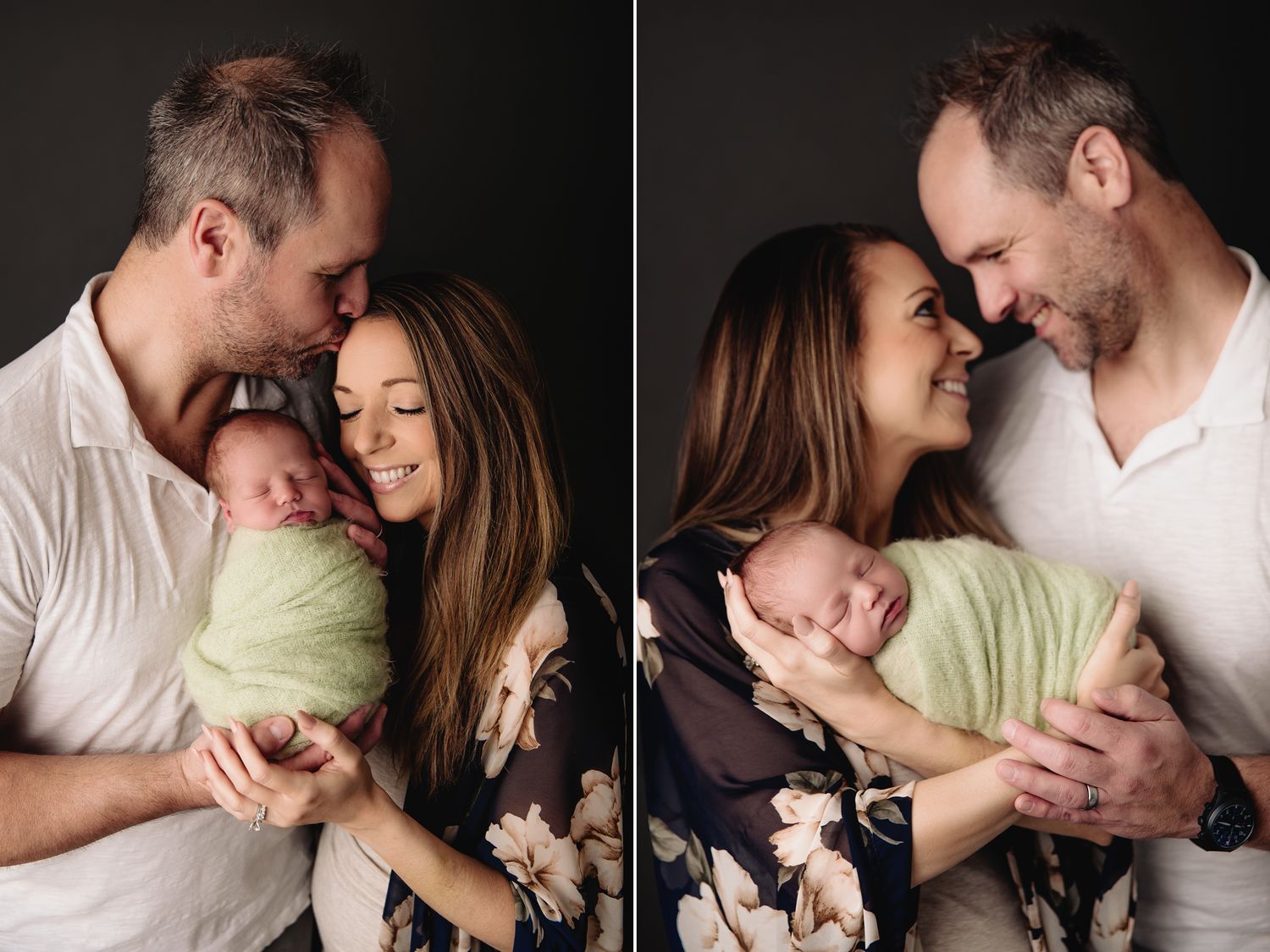 dark grey photo background mom and dad smiling holding baby boy