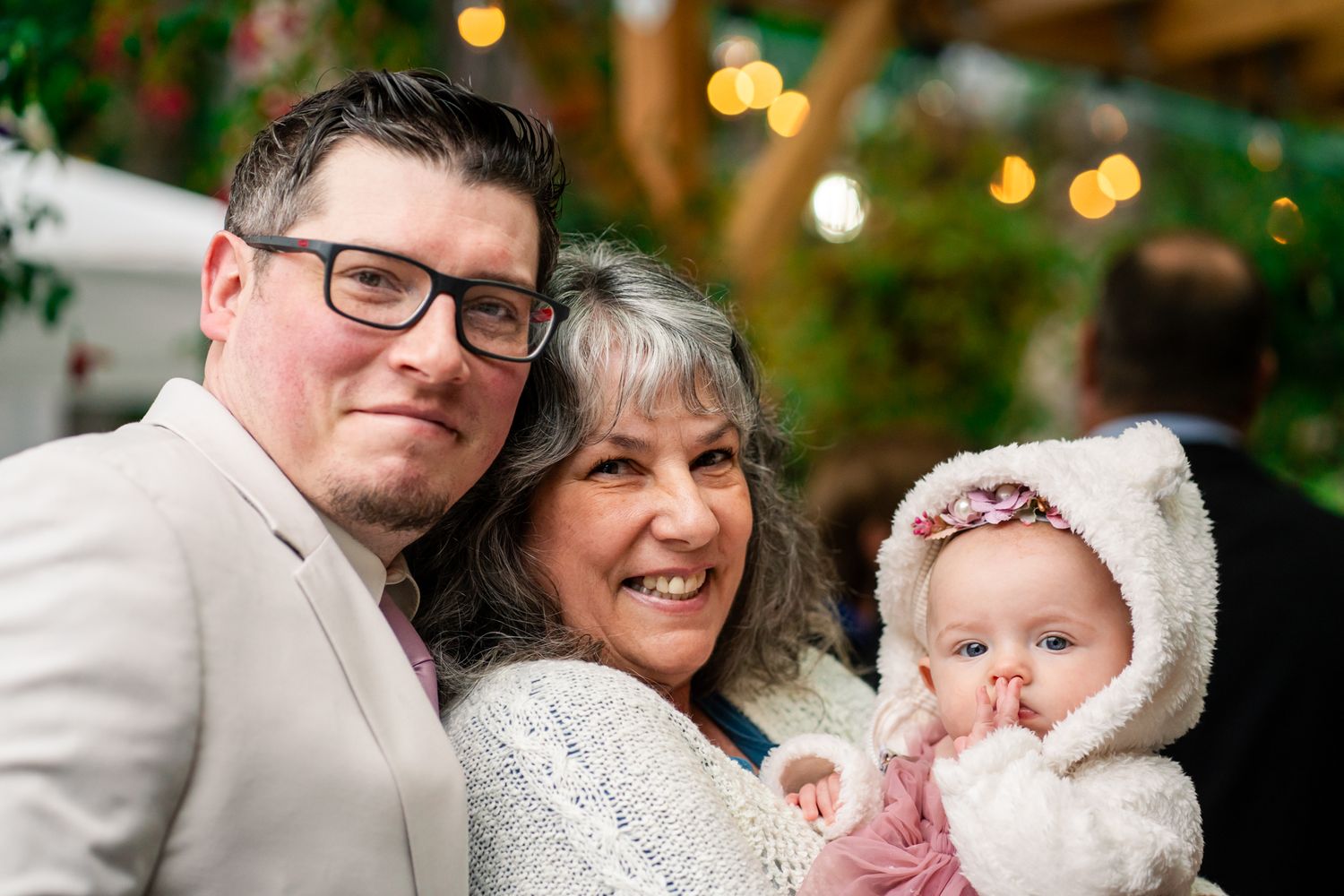 portrait of groom his mom and baby daughter