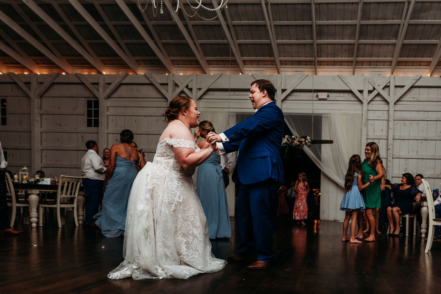 Bride and Groom share a dance at The White Barn at Lucas Farms in Oakland, MD