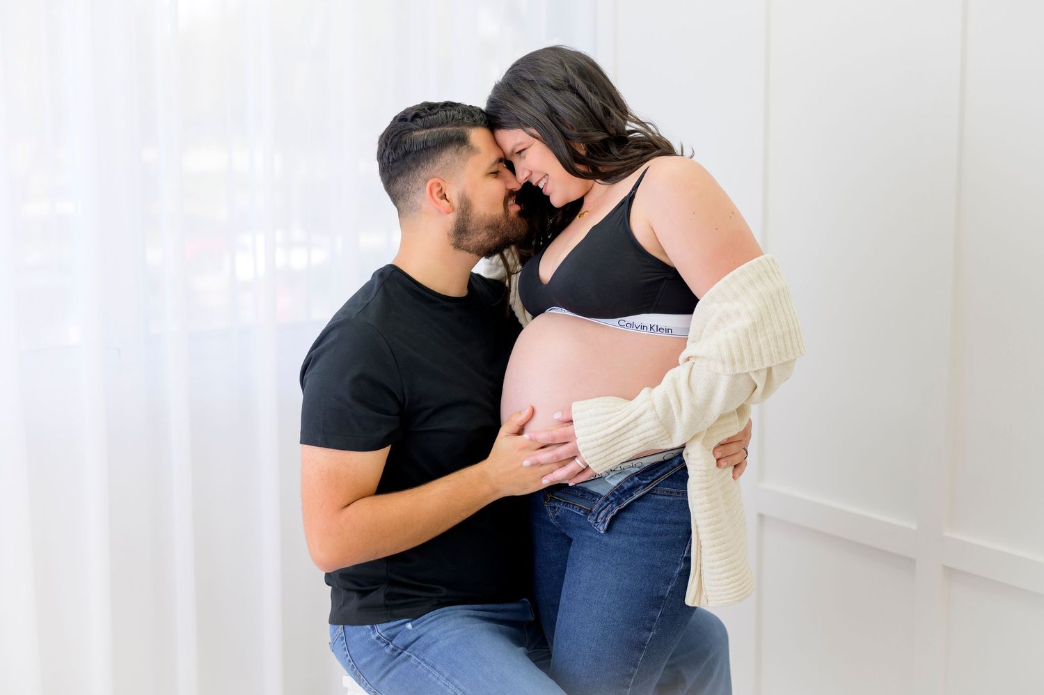 modern maternity studio session with calvin klein black and white outfits