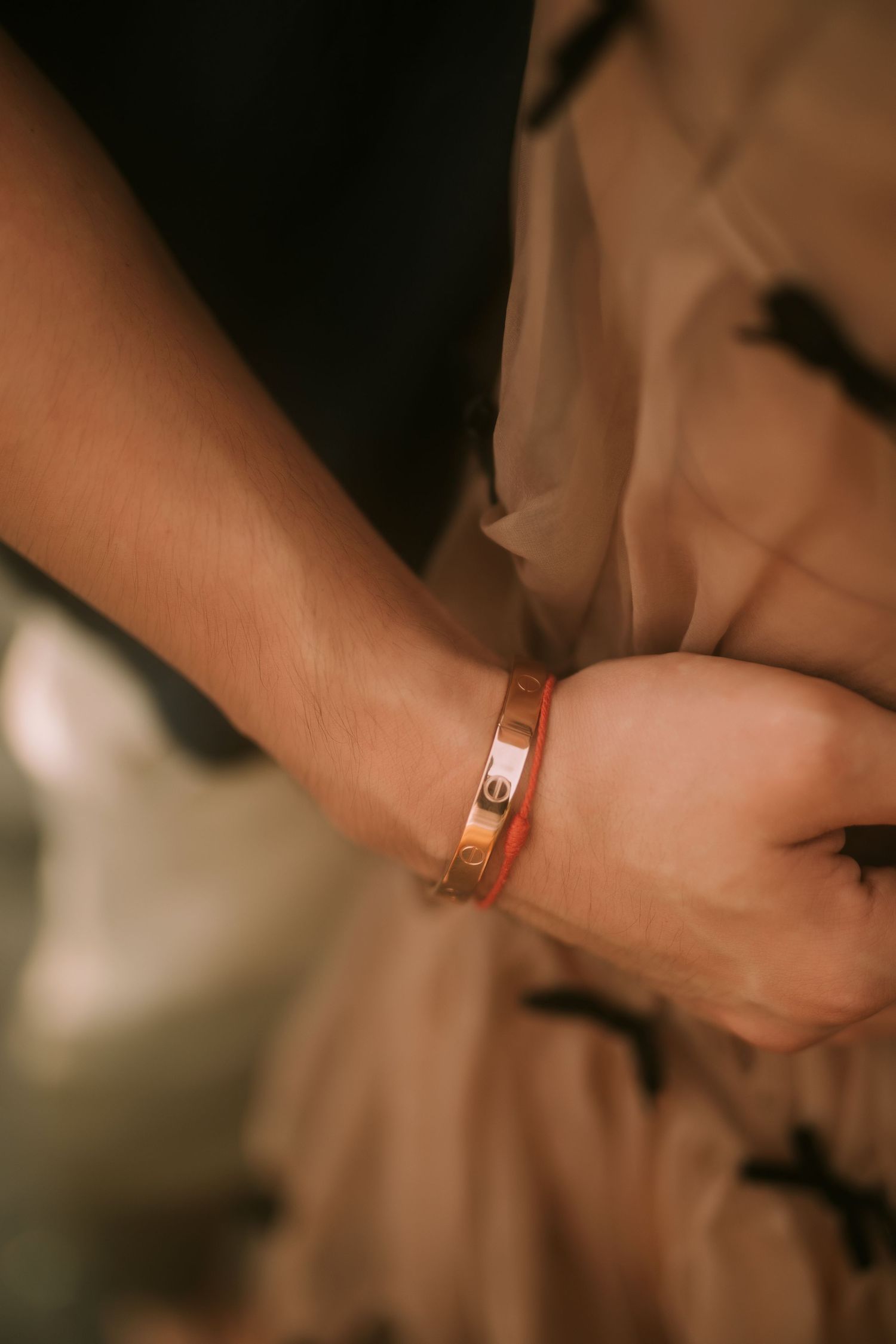 Close-up shot of hands wearing elegant wedding rings.