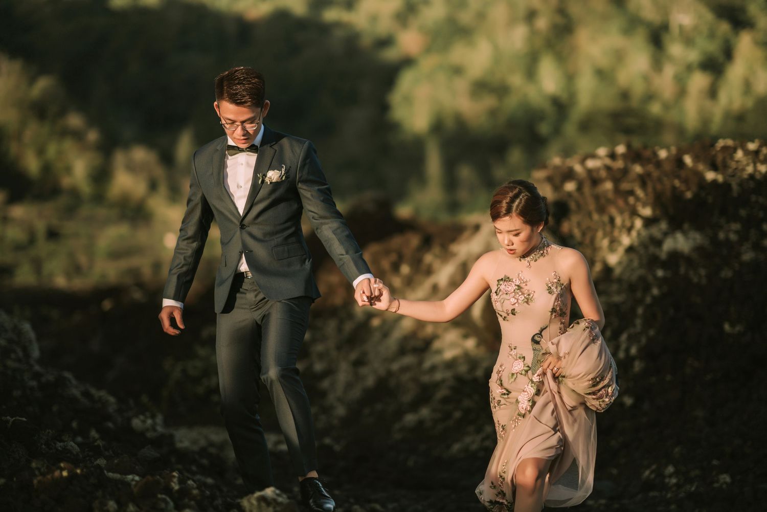 Elegant wedding portraits captured during golden hour in mountainous terrain.