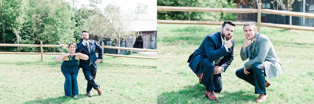 Wedding party members playfully pose together on a grassy lawn at an outdoor venue.